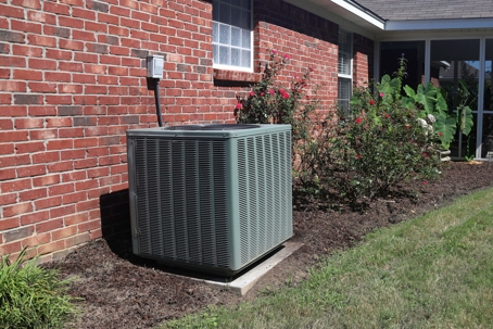 condenser next to brick house