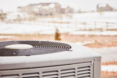 snow starting to fall on ac unit