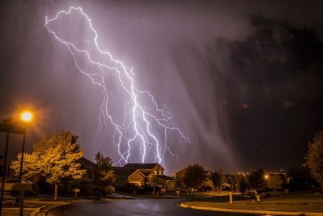 lightning strikes near neighborhood at night